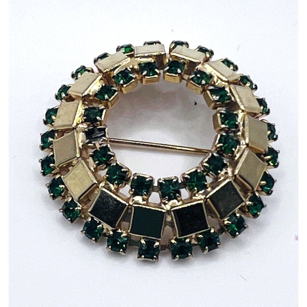 Vintage brooch with green stones on gold tone metal
